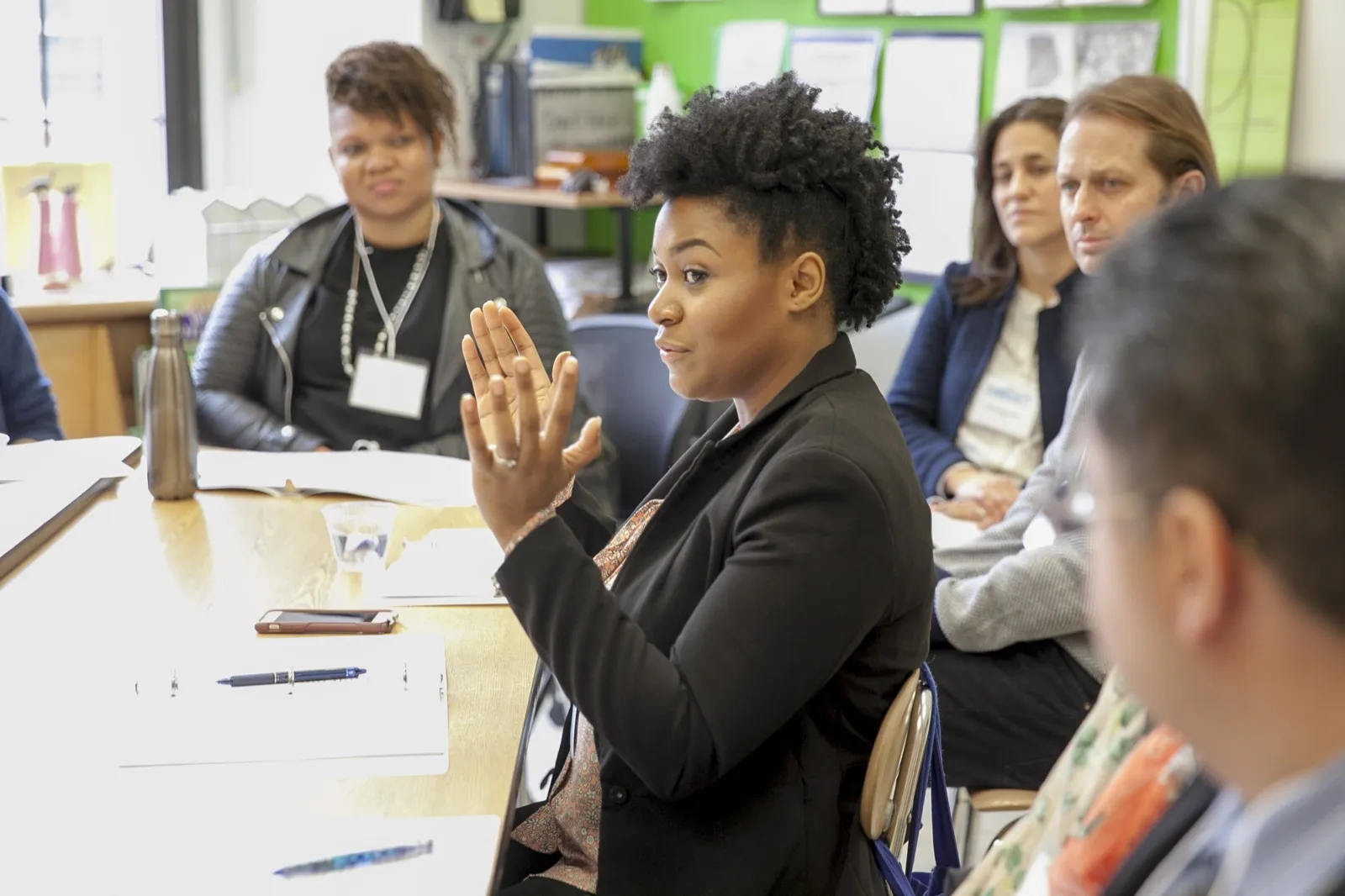A Pollyanna facilitator speaking during a group discussion